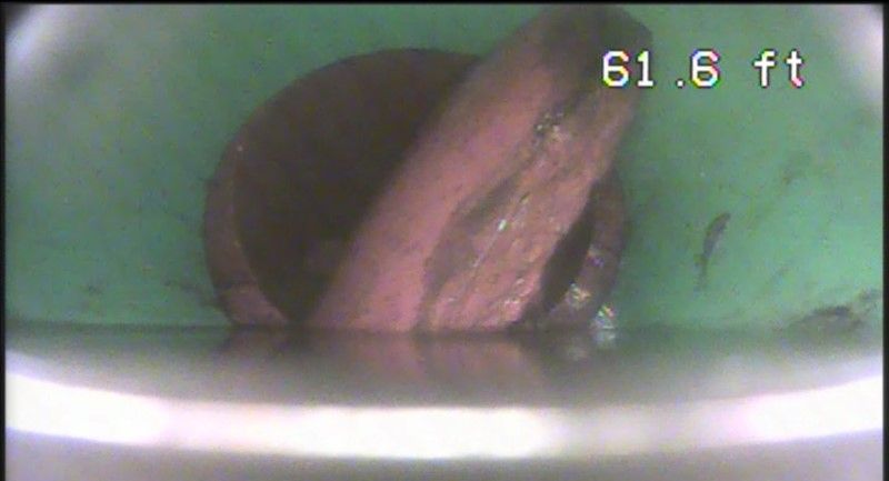 This customer had a couple of companies come out to unclog her sewer, but it would clog back up in 2 weeks. We first got drainage so we could inspect the line with the camera. We found a chunk of clay tile that had broken off and wedged into the pipe. We were able to get it out.
